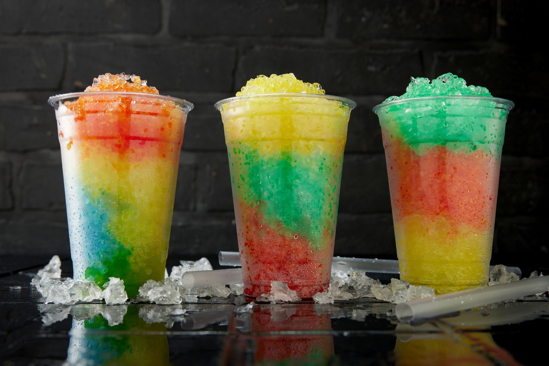 Delicious row of tasty slush drinks.